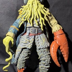 Pirates of the caribbean Disney Action Figure with Yellow and Orange Accents